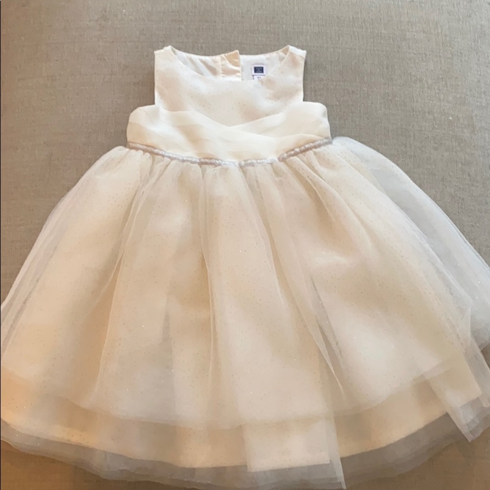 White tulle dress with silver glitter.